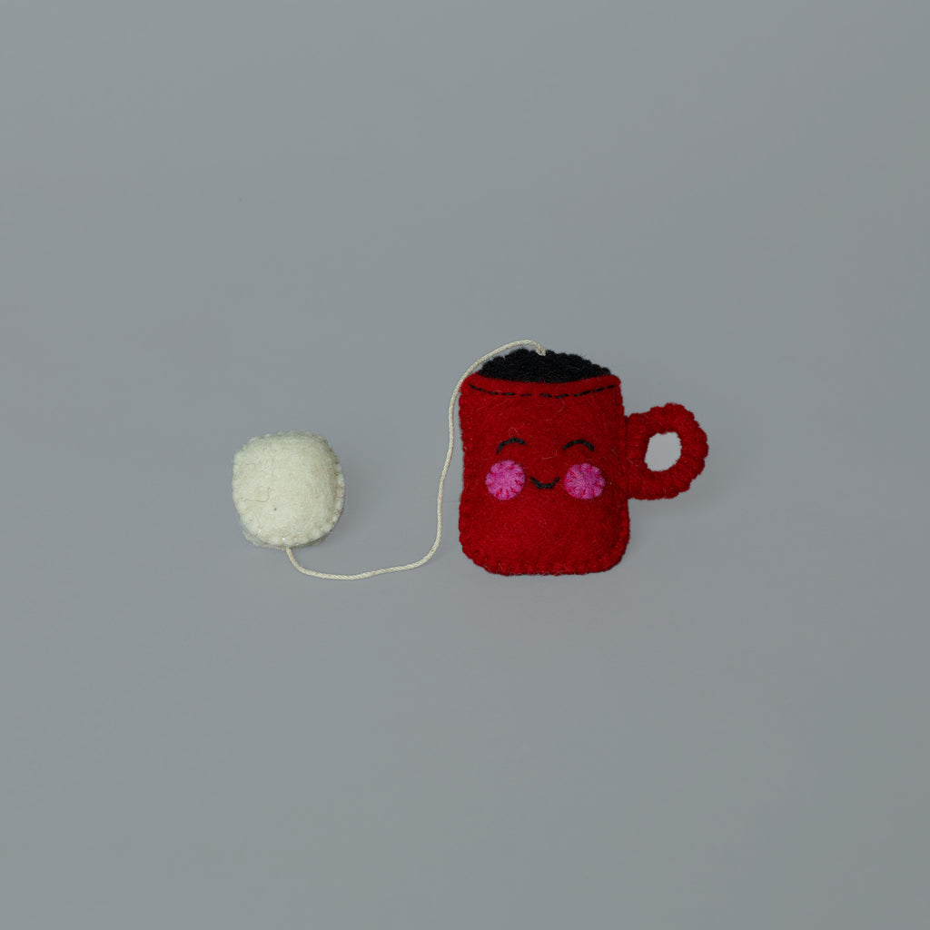 Cocoa and marshmallow on a string wool cat toy